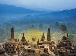 Borobudur is the largest temple relics in the 9th century. It is one of the 7 wonders of the world. It sits on a hilltop, with a view of distant hills