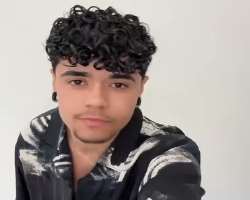 He has piercing in both of his ears.