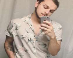 He is a tattoo lover and has engraved one on his arm.