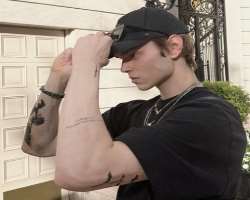 He has a lot of tattoos on both of his arms which hints about his love for tattoos.