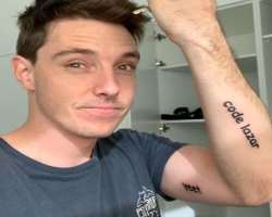 The star has a tattoo on his forearm representing his unique identifier for Fortnite in-game purchases called 