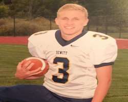 He played football in his high school at the position of the Kicker.