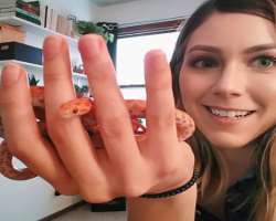 Marz is an animal lover her pet list includes one dog, three rats, and one snake named Pip.