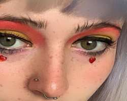She has piercings in her nose septum as well as a side nose.