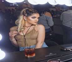 Nashaly consuming alcohol