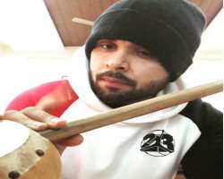 Apart from singing, he can also play Tumbi.