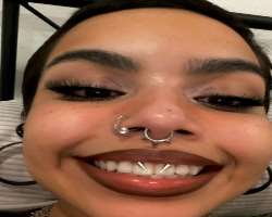 The star has piercing in her nose septum, side nose even on her lips.