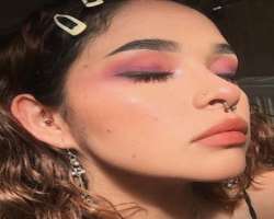 She has piercings in her nose septum, side nose, and different piercings in her ears.