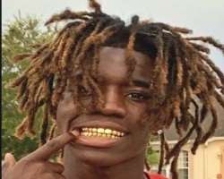 He has piercing in his ears and also got gold plating in his teeth He has piercing in his ears and also got gold plating in his teeth.