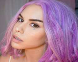 She colors her hair in different shades like pink, purple, and blue.