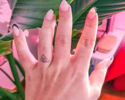 The star is a tattoo lover and got a tattoo on her ring finger. Also one on her wrist.