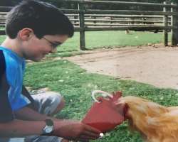 He shows his love for animals by feeding them He shows his love for animals by feeding them.