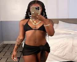 She has piercing on her belly button alongside her ears and nose.