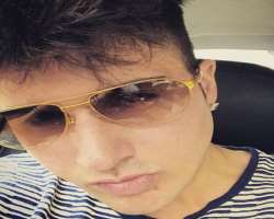 He has piercing in his ears and also loves to wear sunglasses.