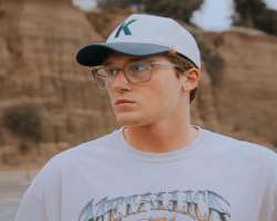 Coy is often seen wearing glasses in his post. 